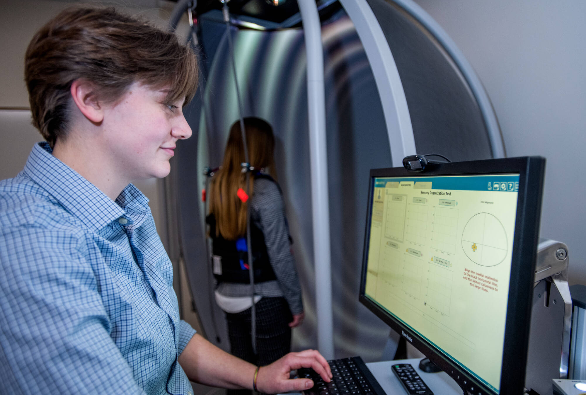 A student providing a Vestibular test